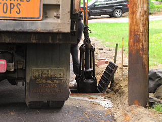 Catch basin cleaning claw