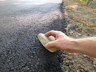 Flattening the berm with a rock