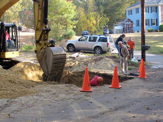 Hole in the ground at road edge