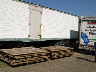 Stacked fence pieces at storage